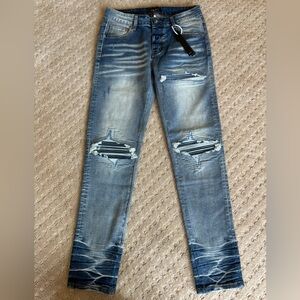 Amiri distressed embroidered patch acid wash jeans men’s size 32x32 luxury jeans